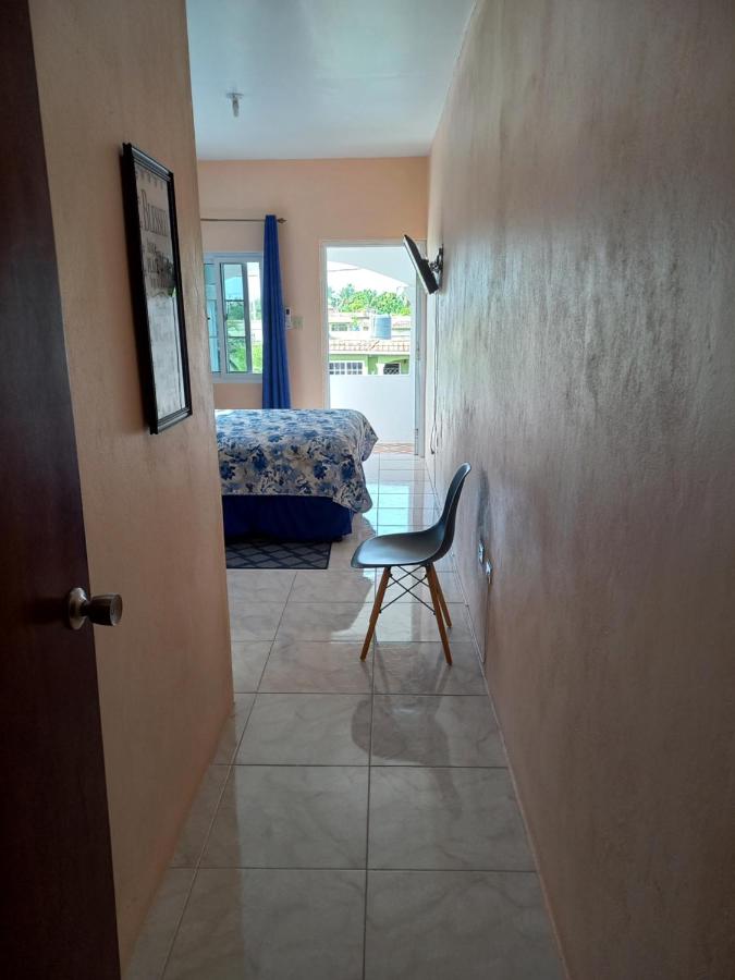 Hallway leading through to the bedroom and balcony